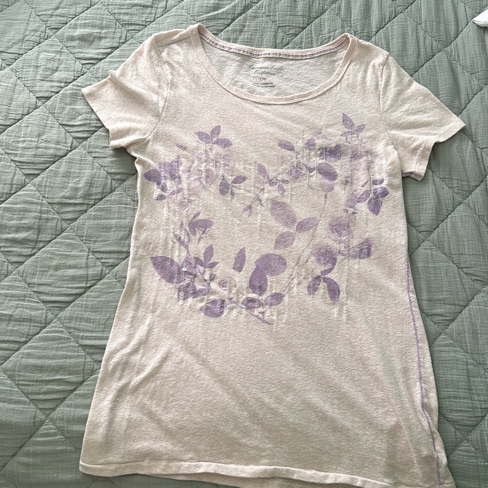 American Eagle dressy T-shirt in good condition with some sequence.